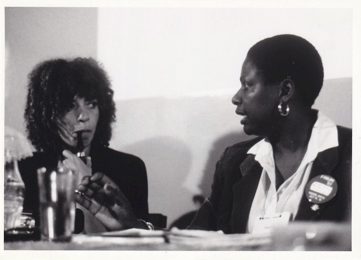 ‘Speaking of Nairobi’ (1986) by Tina Horne. Back of the photograph reads: 'Angela Davis (L) and Dr Glena participate in panel discussion on black women history at forum '85'